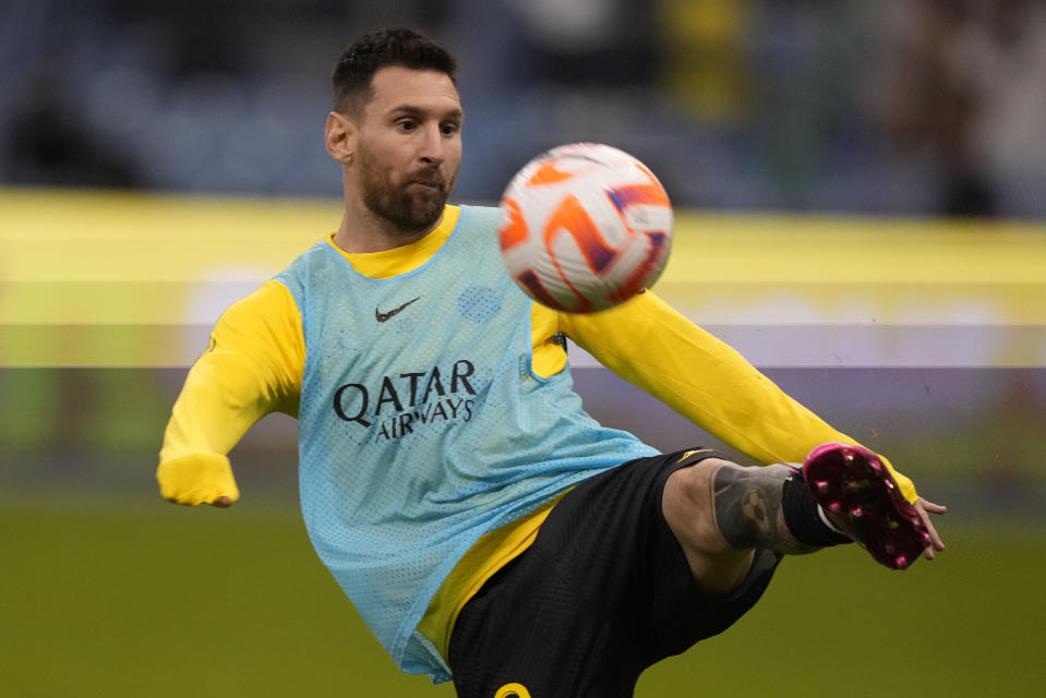 PSG's Lionel Messi warms up prior to the start of a friendly soccer match between a combined XI of Saudi Arabian teams Al Nassr and Al Hilal at the King Saud University Stadium, in Riyadh, Saudi Arabia, Thursday, Jan. 19, 2023. (AP Photo/Hussein Malla)