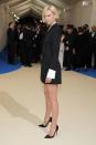 Karlie looked like the ultimate girl boss in this black Carolina Herrera minidress with white cuffs.