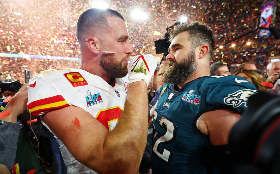 Kansas City Chiefs tight end Travis Kelce (87) talks with his brother Philadelphia Eagles center Jason Kelce (62) after he won Super Bowl LVII at State Farm Stadium.