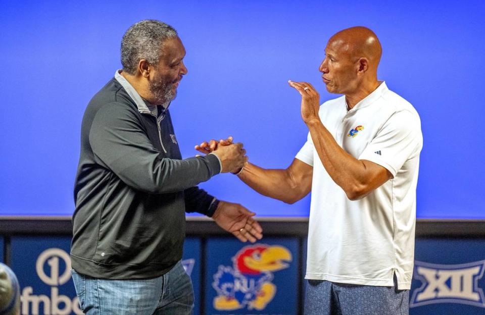 Film director and screenwriter Kevin Willmott, left, greets Fred Quartlebaum, director of basketball operations for the Kansas Men’s basketball team, before Willmott spoke to the basketball team about the importance of Juneteenth. Willmott is also a professor of film and media studies at KU.