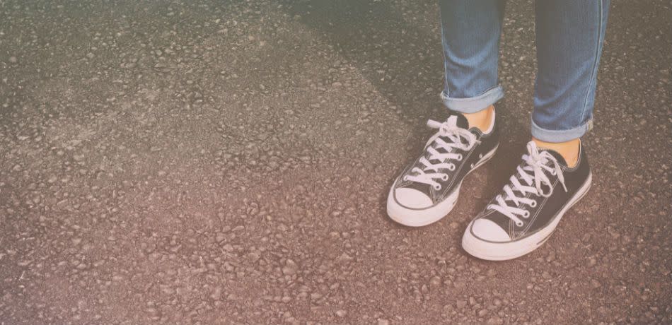 A little girl's shoes on the road.