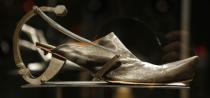 This Feb. 11, 2013 photo shows Kei Kagami's oxidized metal and leather footwear on display at the "Shoe Obsession" exhibit at The Museum at the Fashion Institute of Technology Museum in New York. The exhibition, showing off 153 specimens, runs through April 13. (AP Photo/Kathy Willens)