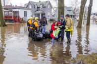 <p>Emergency crews help evacuate residents Wednesday, Feb. 21, 2018, in Elkhart, Ind. Crews are using boats to help northern Indiana residents amid flooding from melting snow and heavy rain moving across the Midwest. (Photo: Becky Malewitz /South Bend Tribune via AP) </p>