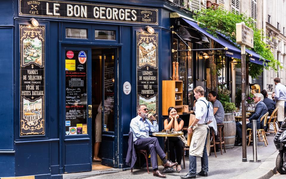 people outside French cafe