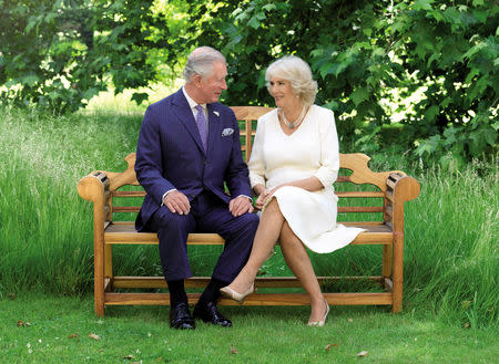 Britain's Prince Charles and the Duchess of Cornwall sit in the grounds of Clarence House in 2018. This photograph features in their Christmas card this year and has been released today by Clarence House in London, Britain, December 14, 2018. Hugo Burnand/Handout via REUTERS