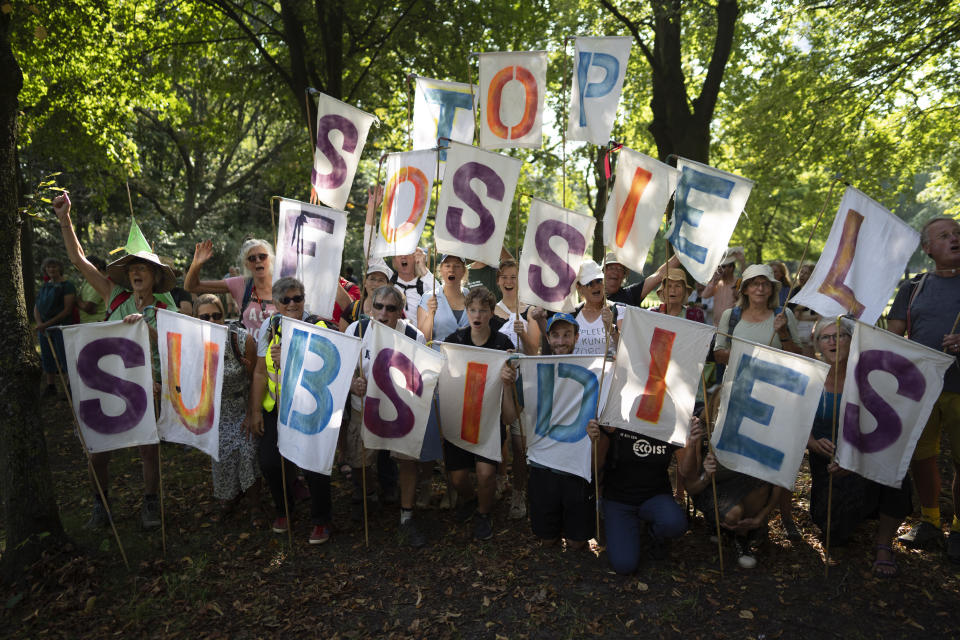 Protestors display banners reading "stop Fossil Subsidies" as they gather with the intent to block a highway during a climate protest of Extinction Rebellion and other activists near the Dutch parliament in The Hague, Netherlands, Saturday, Sept. 9, 2023. (AP Photo/Peter Dejong)