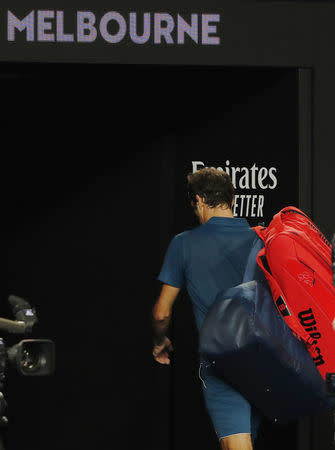 Tennis - Australian Open - Fourth Round - Melbourne Park, Melbourne, Australia, January 20, 2019. Switzerland’s Roger Federer leaves the court after losing the match against Greece’s Stefanos Tsitsipas. REUTERS/Adnan Abidi