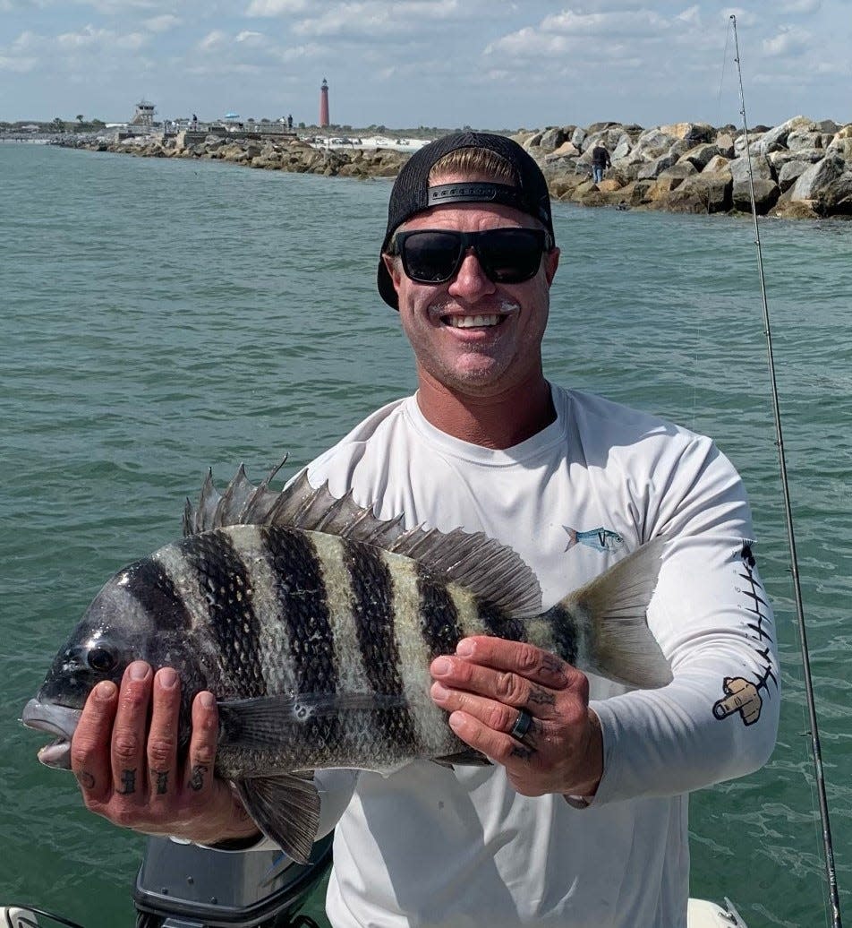 Local angler Stephen Flowers shows off a nice sheepshead he caught alongside the Ponce Inlet jetty, using live shrimp.