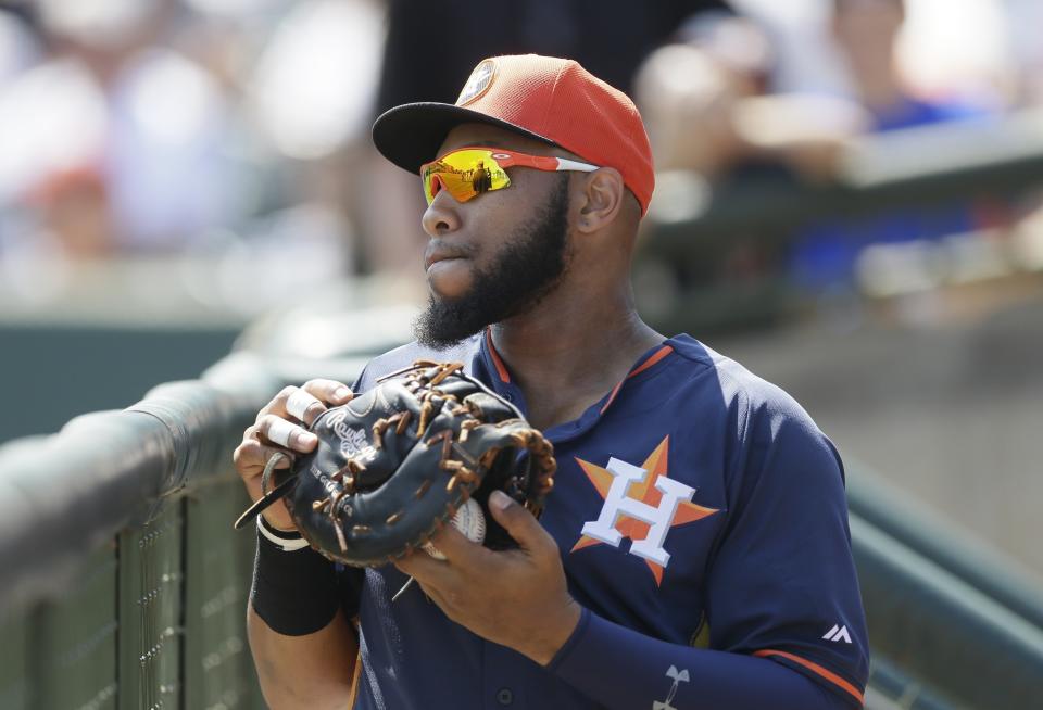 FILE - Houston Astros first baseman Jon Singleton stands in the dugout before the start of a spring training exhibition baseball game against the Washington Nationals in Kissimmee, Fla., March 15, 2015. Singleton is being called up by the Astros, returning to the team he last played for in 2015. Singleton told The Associated Press he was heading to Baltimore on Monday, Aug. 7, 2023, to join the team for the opener of a three-game series with the Baltimore Orioles, who have the best record in the American League. (AP Photo/Carlos Osorio, File)