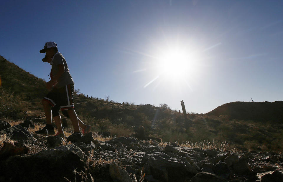 <p>Hikers brave the afternoon sun as the temperatures hit 110-degrees June 15, 2017, in Phoenix. (Ross D. Franklin/AP) </p>