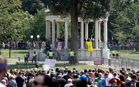 Organisers cut short their free speech rally on Boston Common bandstand as their numbers were dwarfed by counter-protesters - Credit: AP