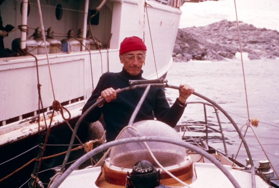 <p>Jacques-Yves Cousteau aboard a submarine with the RV Calypso off to the side in 1970.</p>