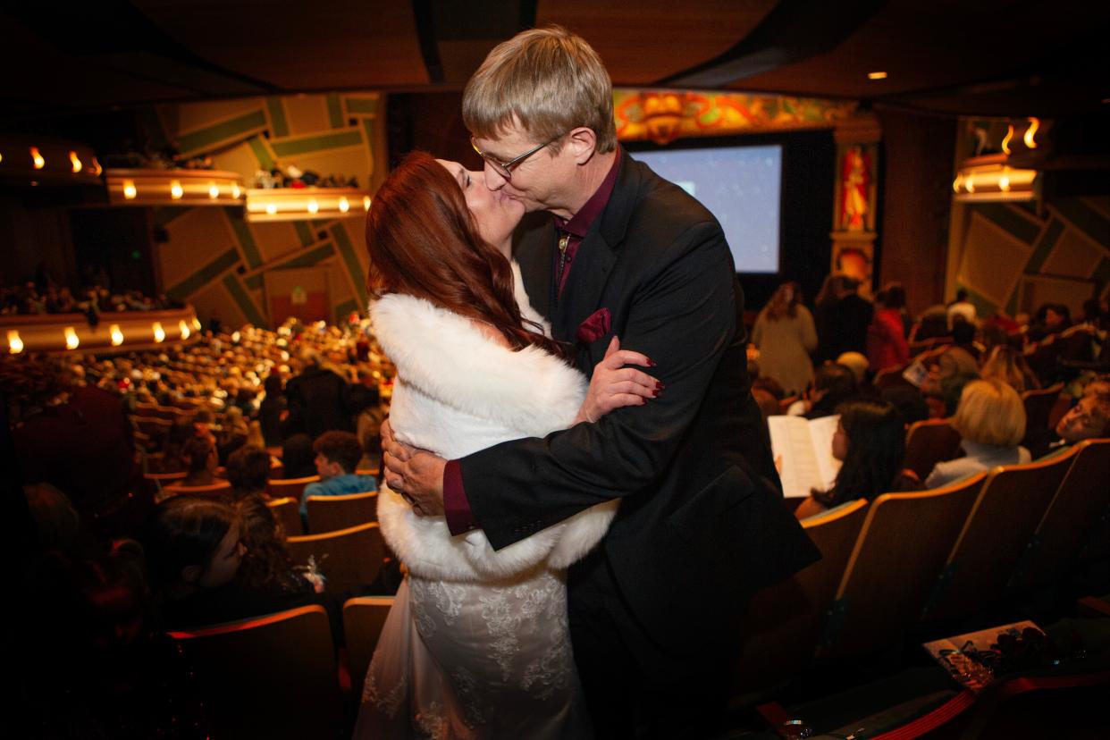 Newlyweds Shelly and Ray Price, from Veneta, celebrate with a kiss before watching The Nutcracker ballet at the Hult Center with family and friends.