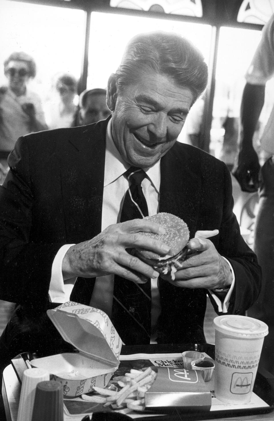 U.S. President Ronald Reagan eats at a McDonald's restaurant after addressing students at the University of Alabama in Tuscaloosa, Ala., on Oct. 15, 1984. The president ordered a Big Mac, large fries and a sweetened iced tea.