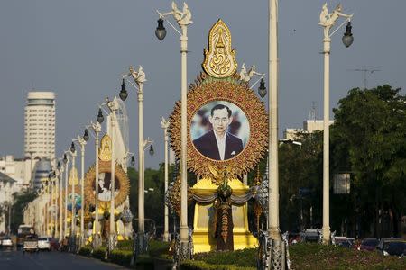 A picture showing Thailand's King Bhumibol Adulyadej is seen on a street in Bangkok, Thailand April 17, 2016. REUTERS/Jorge Silva