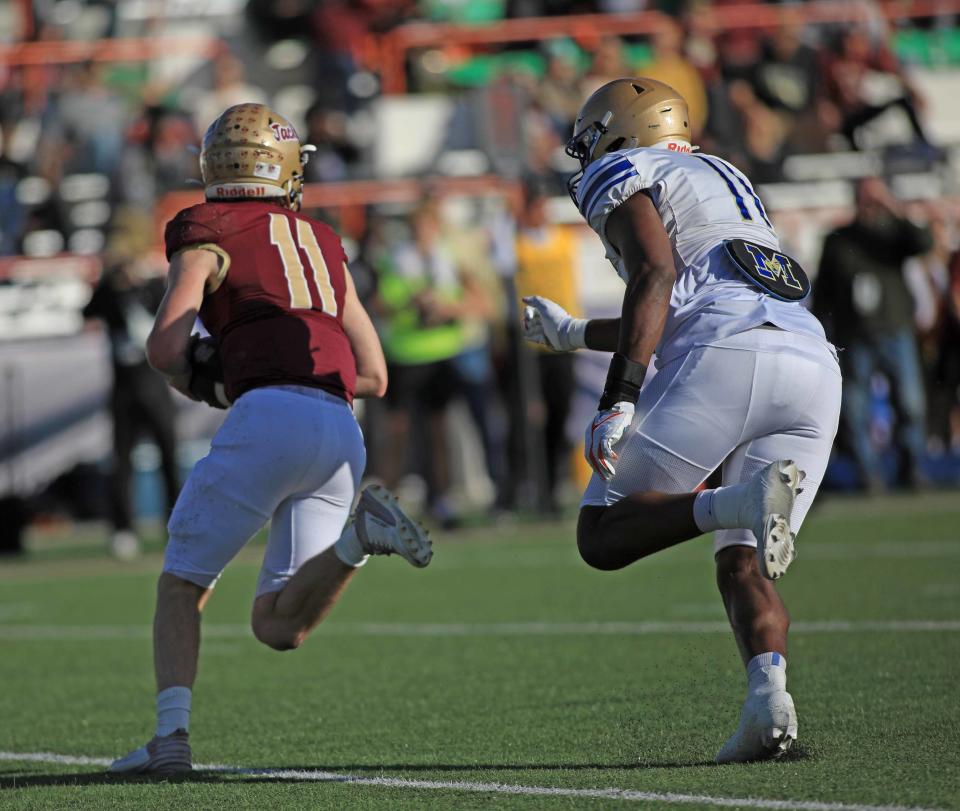 Mainland's LJ McCray (11) chases down St. Augustine quarterback Locklan Hewlett (11) during the FHSAA Class 3S state championship game on Thursday in Tallahassee.