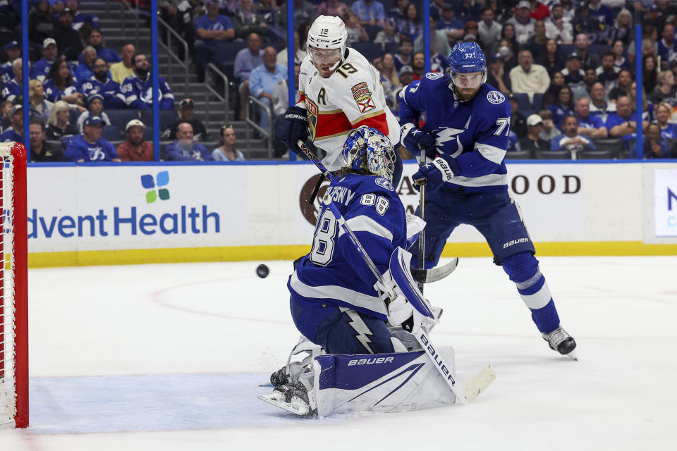 Florida Panthers' Matthew Tkachuk (19) interferes with Tampa Bay Lightning goaltender Andrei Vasilevskiy as Victor Hedman (77) defends during the first period of an NHL hockey game Tuesday, Feb. 28, 2023, in Tampa, Fla. After review the goal was disallowed due to interference. (AP Photo/Mike Carlson)