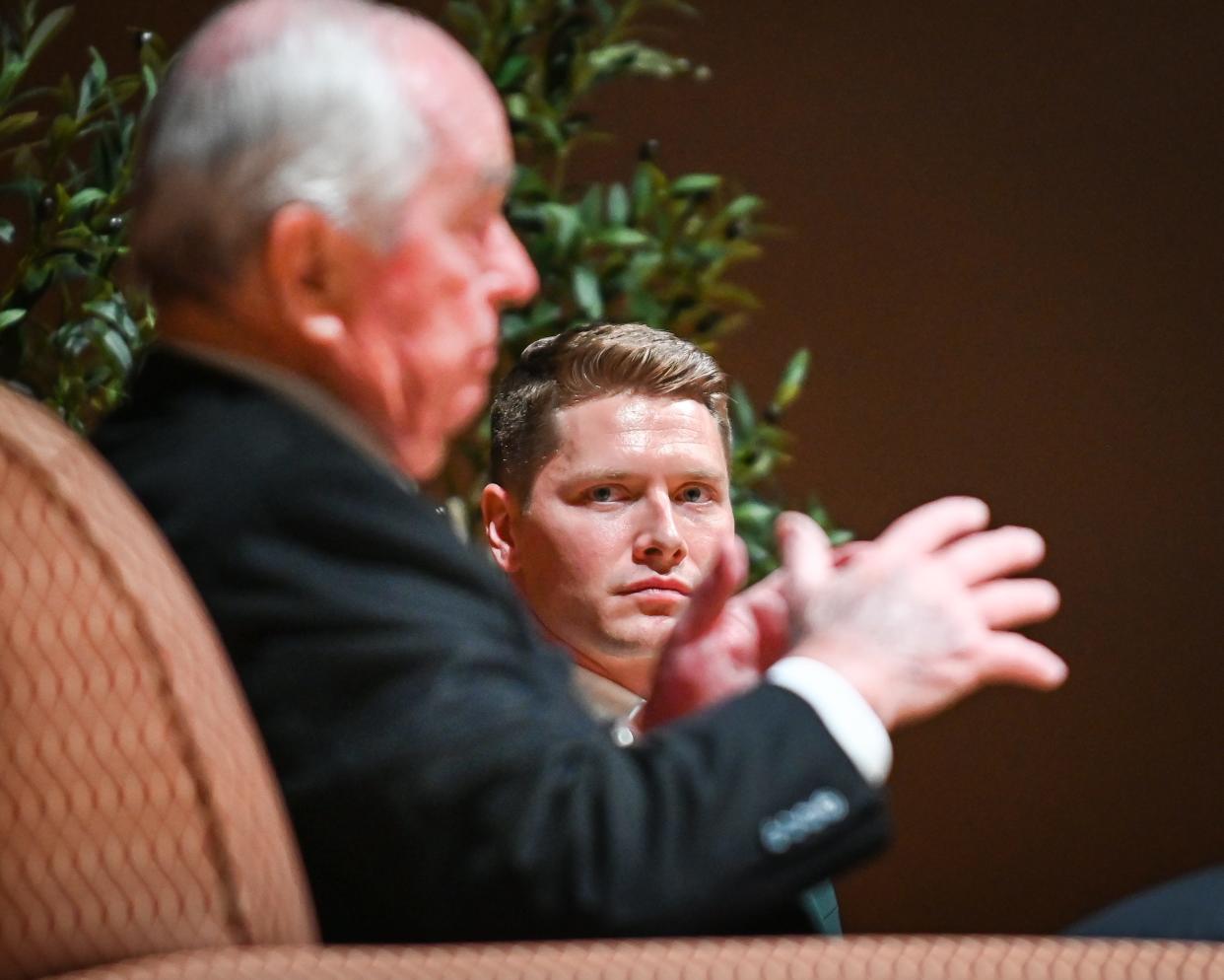 Indianapolis 500 winner Josef Newgarden listens as IndyCar owner Roger Penske shares his story Tuesday with students at Carroll University in Waukesha.