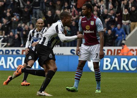 Newcastle United's Loic Remy (C) celebrates scoring against Aston Villa during their English Premier League soccer match at St James' Park in Newcastle, northern England, February 23, 2014. REUTERS/Nigel Roddis