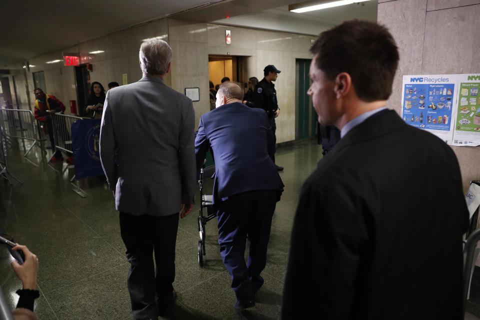 Harvey Weinstein, center, exits following his trial on charges of rape and sexual assault, Monday, Jan. 27, 2020, in New York. (AP Photo/Michael Owens)