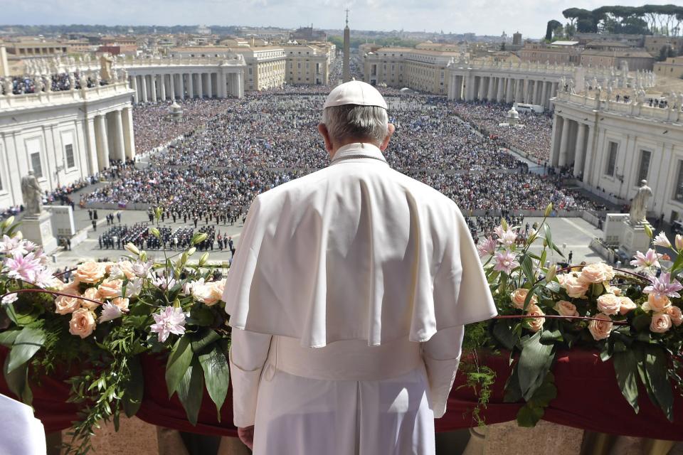 Pope Francis addresses the crowd prior to delivering his Urbi et Orbi (to the city and to the world) message from the main balcony of St. Peter's Basilica, at the Vatican, Sunday, April 16, 2017. On Christianity's most joyful day, Pope Francis lamented the horrors generated by war and hatred, delivering an Easter Sunday message that also decried the "latest vile" attack on civilians in Syria. (L'Osservatore Romano/Pool Photo via AP)