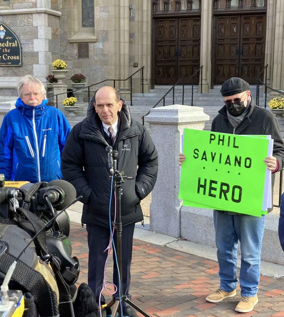 Mitchell Garabedian, center, pictured outside the Cathedral of the Holy Cross in Boston in November 2021.