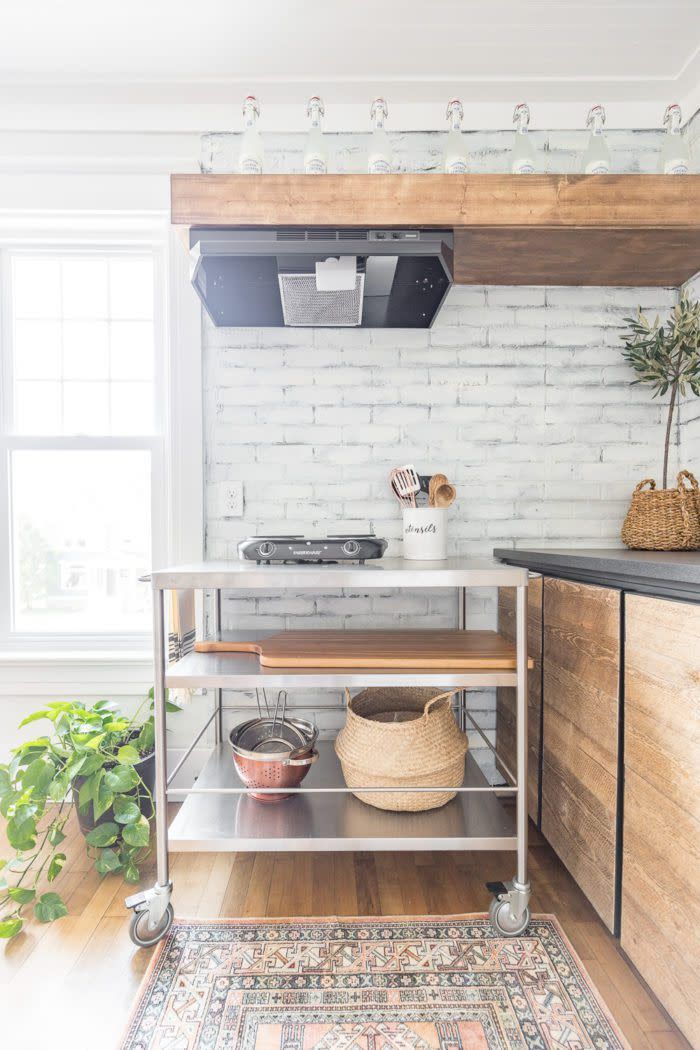 kitchen with portable burners on rolling cart