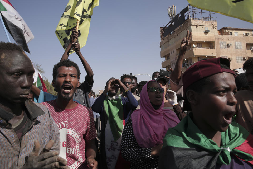 People protests against the October military coup and subsequent deal that reinstated Prime Minister Hamdok in Khartoum, Sudan, Monday, Dec. 6, 2021. (AP Photo/Marwan Ali)