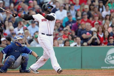 FILE PHOTO: Boston Red Sox designated hitter Ortiz follows through as he flies out in eighth inning against the Toronto Blue Jays during their MLB American League East baseball game in Boston