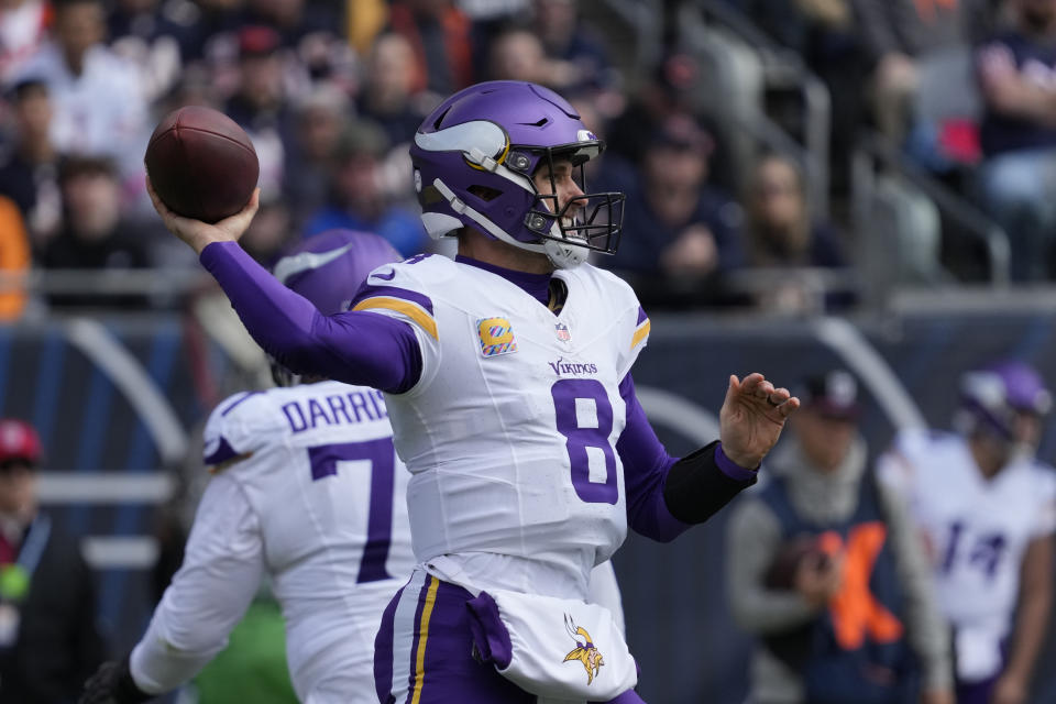 Minnesota Vikings quarterback Kirk Cousins throws during the first half of an NFL football game against the Chicago Bears, Sunday, Oct. 15, 2023, in Chicago. (AP Photo/Nam Y. Huh)