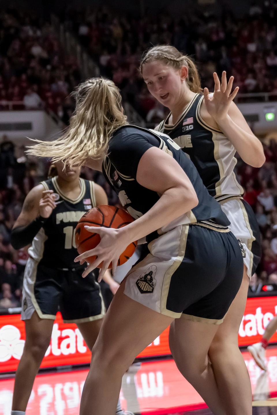 Purdue Boilermakers forward Caitlyn Harper (34) and Purdue Boilermakers forward Mary Ashley Stevenson (20) work together on a rebound during the NCAA women’s basketball game against the Indiana Hoosiers, Sunday Jan. 21, 2024, at Mackey Arena in West Lafayette, Ind. Indiana won 74-68.