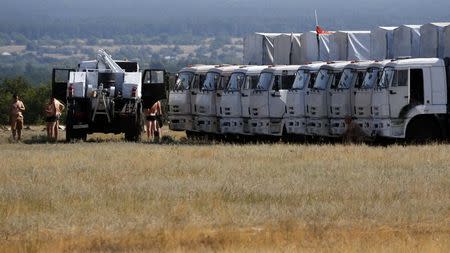 A Russian convoy of trucks carrying humanitarian aid for Ukraine is parked at a camp near Donetsk, Rostov Region, August 22, 2014. REUTERS/Alexander Demianchuk