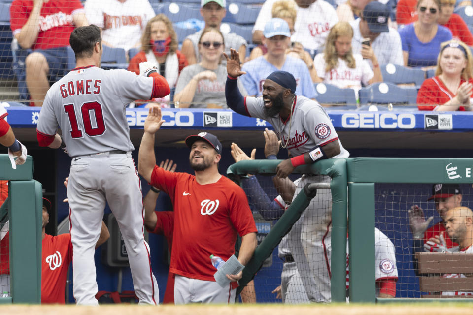 PHILADELPHIA, PA - JULY 29: Yan Gomes #10 of the Washington Nationals celebrates with Josh Harrison #5 after hitting a two run home run in the top of the seventh inning against the Philadelphia Phillies during Game One of the doubleheader at Citizens Bank Park on July 29, 2021 in Philadelphia, Pennsylvania. The Nationals defeated the Phillies 3-1. (Photo by Mitchell Leff/Getty Images)