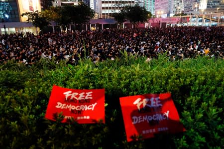 Demonstrators attend a rally ahead of the G20 summit, urging the international community to back their demands for the government to withdraw a the extradition bill in Hong Kong