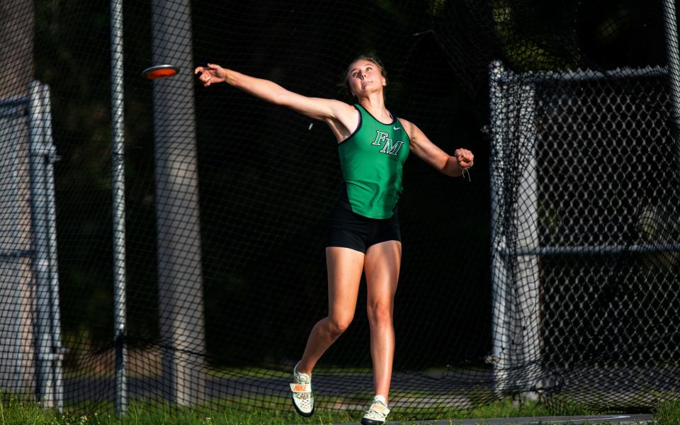 Fort Myers High Schools’ Julia Lemmon throws the discus during a practice session at the school.  