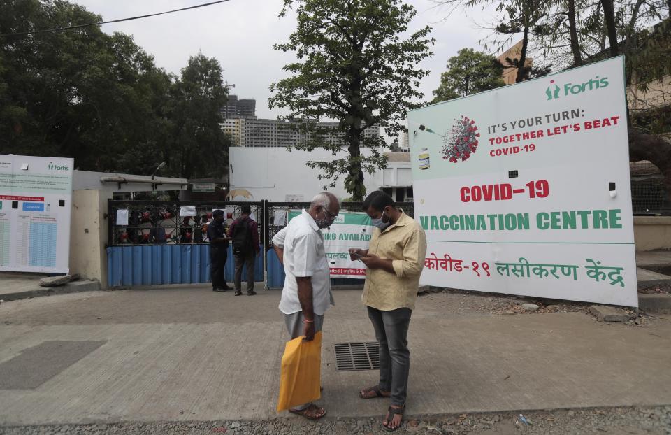 People stand outside a vaccination centre after being turned back because of shortage of the COVID-19 vaccine in Mumbai, India, Thursday, April 8, 2021. Some vaccination centers in Mumbai turned away people due to a shortage. Worries about vaccine supplies have led to criticism of Prime Minister Narendra Modi’s government, which has exported 64.5 million doses to other nations. Now, India has reversed course. Last month, COVAX said shipments of up to 90 million doses of the AstraZeneca vaccines were delayed because the Serum Institute of India decided to prioritize domestic needs. (AP Photo/Rafiq Maqbool)