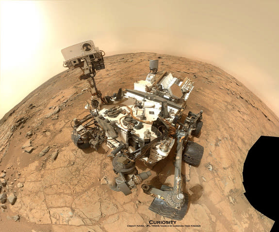 This self-portrait, composed of more than 50 images taken by Curiosity's MAHLI camera on Feb. 3, 2013, shows the rover at the John Klein drill site. A drill hole is visible at bottom left.