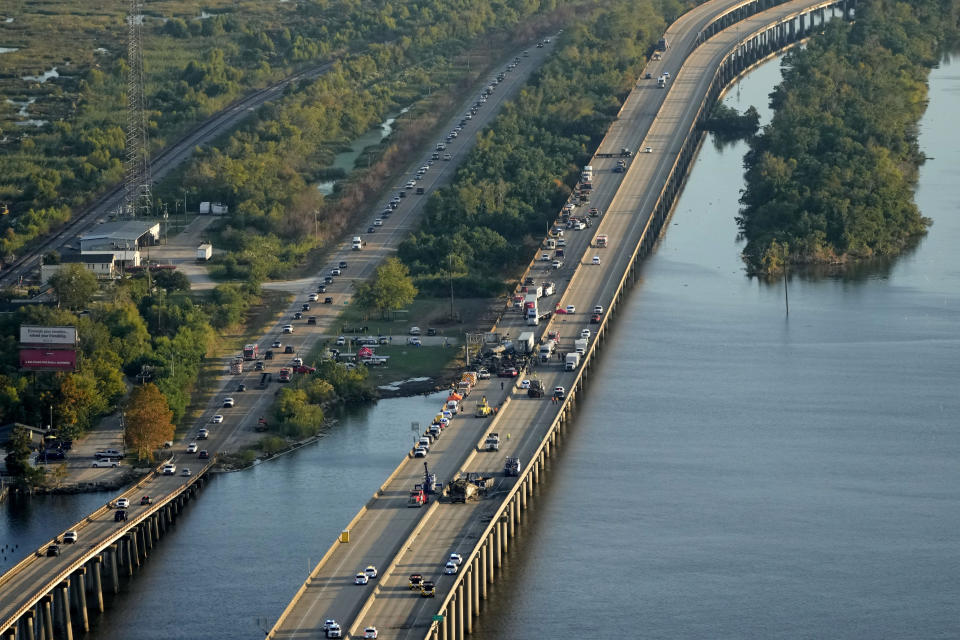 FILE - In this aerial photo, responders are seen near wreckage in the aftermath of a multi-vehicle pileup on I-55 in Manchac, La., Monday, Oct. 23, 2023. Dense smoke reminiscent of last month's “super fog” that rolled into Louisiana has led to a deadly accident that shut down Interstate 10 in the New Orleans area early Tuesday, Nov. 7, police said. (AP Photo/Gerald Herbert, File)