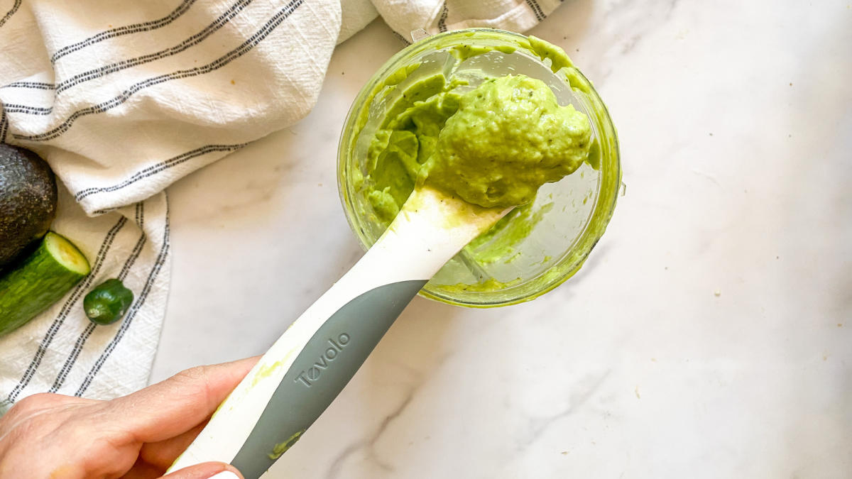 A splash of water is essential to a easily blended avocado sauce