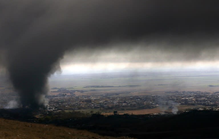 Smoke over Sinjar on November 12, 2015 during an operation, to retake the town from the Islamic State group