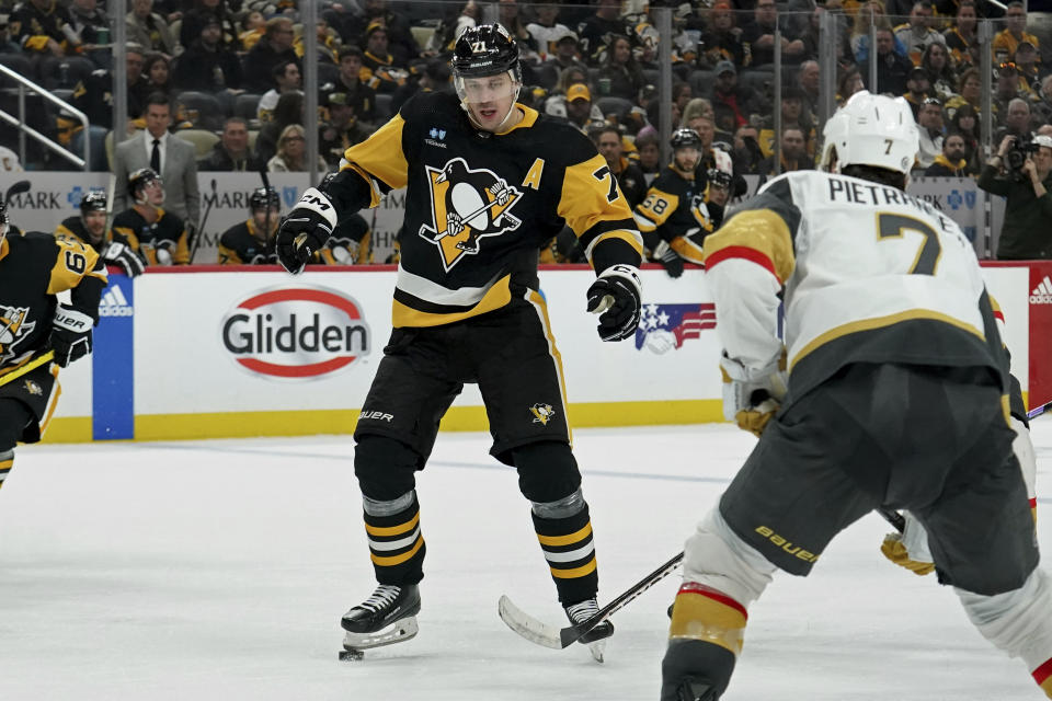 Pittsburgh Penguins' Evgeni Malkin (71) controls the puck with his skate after losing his stick against the Vegas Golden Knights during the second period of an NHL hockey game, Sunday, Nov. 19, 2023, in Pittsburgh. (AP Photo/Matt Freed)