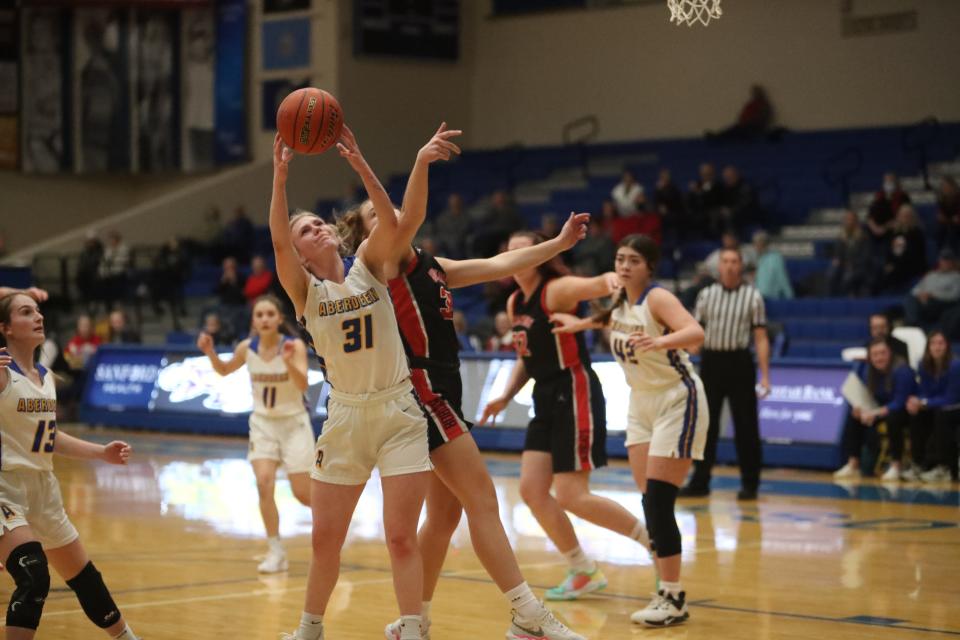 Abby Berry (31) battles for a rebound against a Brookings defender inside Golden Eagles Arena in Aberdeen on Jan. 13, 2022.