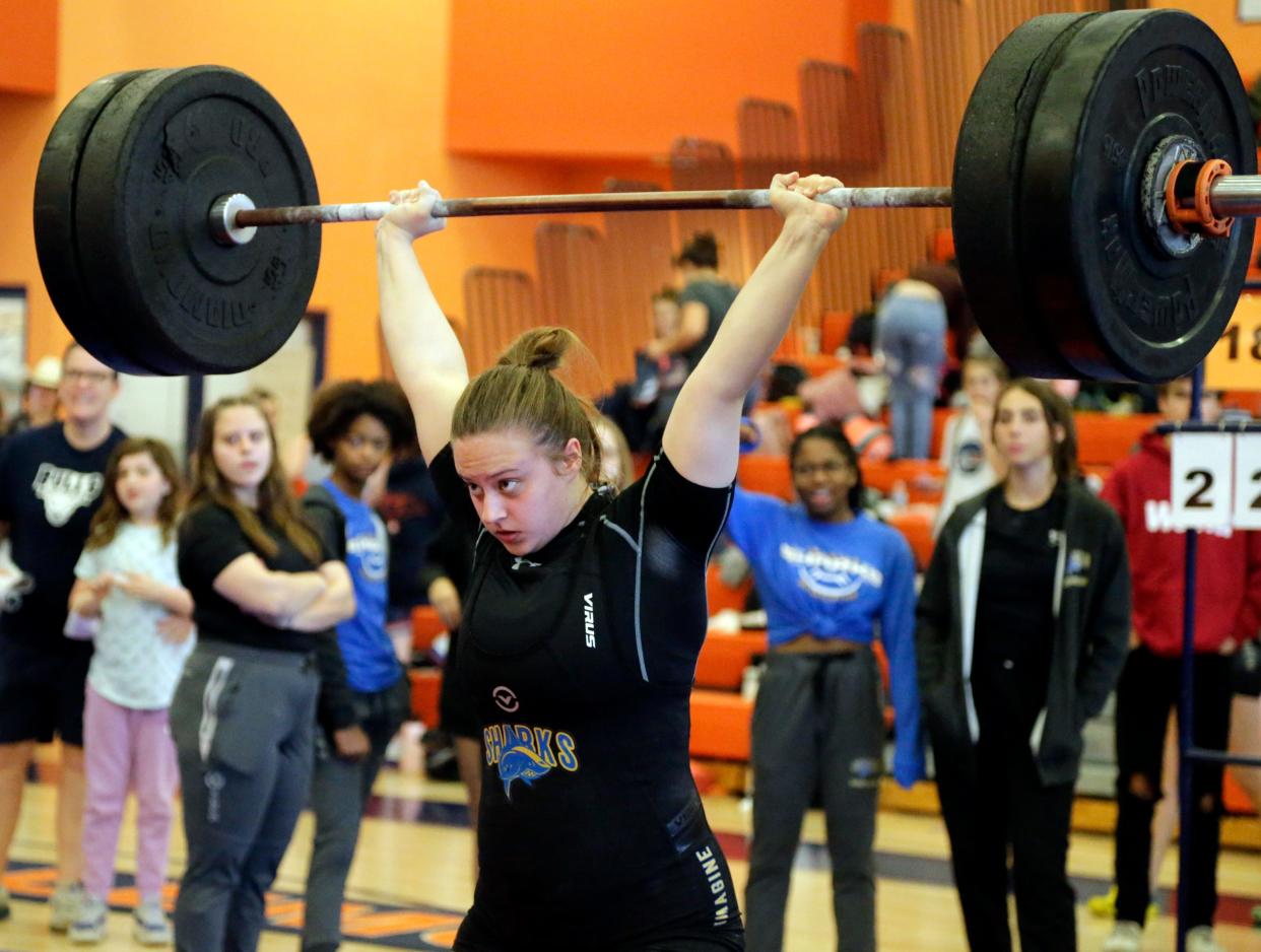 Madison Atwood of Imagine School at North Port hoists 230 pounds in the clean and jerk at the Class 1A-Region 4 meet Saturday afternoon at Lemon Bay High in Englewood. Atwood won the 183-pound division in both the traditional and the snatch events.