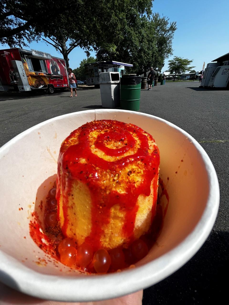 Mexican Candy from Vampire Penguin is mango "snow" ice topped with caramel, chamoy sauce, Tajin and mango boba.