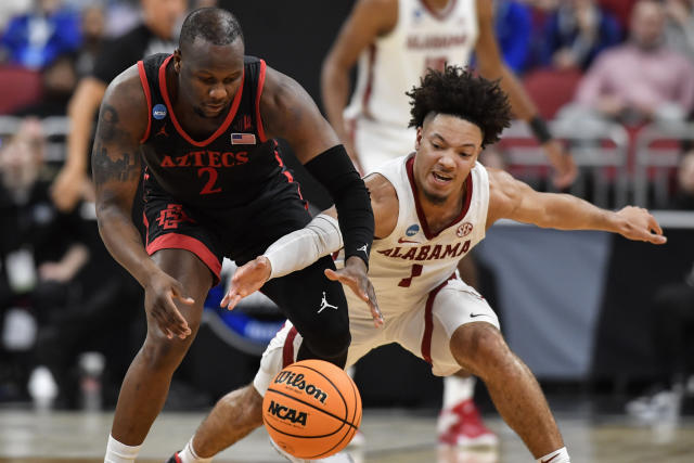 San Diego State guard Adam Seiko (2) and Alabama guard Mark Sears (1) vie for a loose ball in the second half of a Sweet 16 round college basketball game in the South Regional of the NCAA Tournament, Friday, March 24, 2023, in Louisville, Ky. (AP Photo/Timothy D. Easley)