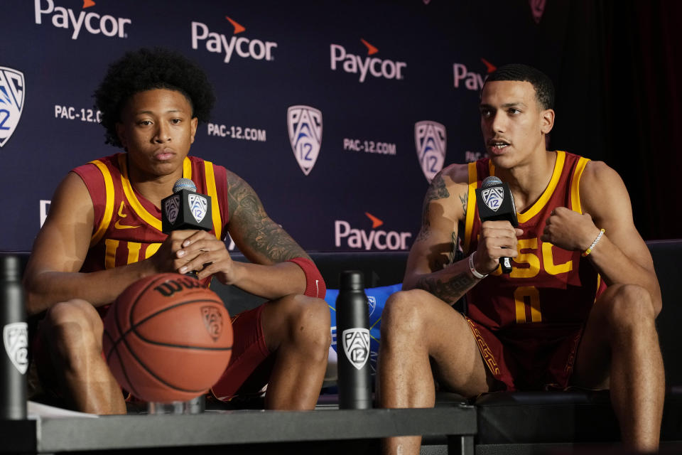 Southern California's Boogie Ellis, left, and Kobe Johnson attend a news conference at the Pac-12 Conference NCAA college basketball media day Wednesday, Oct. 11, 2023, in Las Vegas. (AP Photo/John Locher)