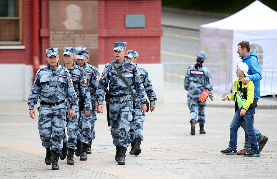 Security personel patrol a square in Moscow hours before the start of the tournament. (PA)