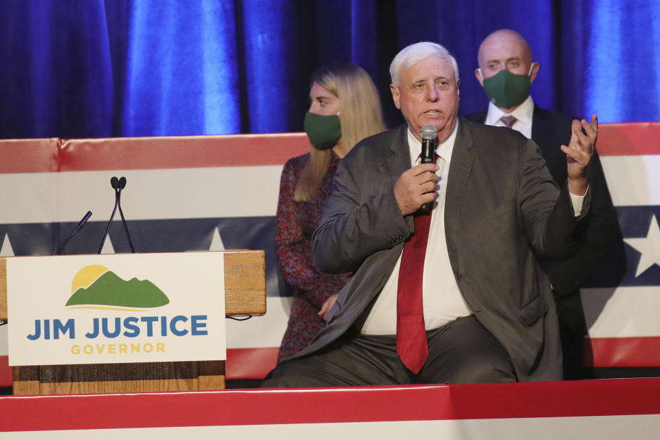 FILE - In this Nov. 3, 2020, file photo, West Virginia Gov. Jim Justice celebrates his reelection at The Greenbrier Resort in White Sulphur Springs, W.Va. While the United States doubled its population over the past seven decades, West Virginia headed in the other direction. With West Virginia poised to lose another congressional seat due to its long, steady population decline, Republican lawmakers are convinced a massive tax cut is the key to reversing the trend.(AP Photo/Chris Jackson, File)