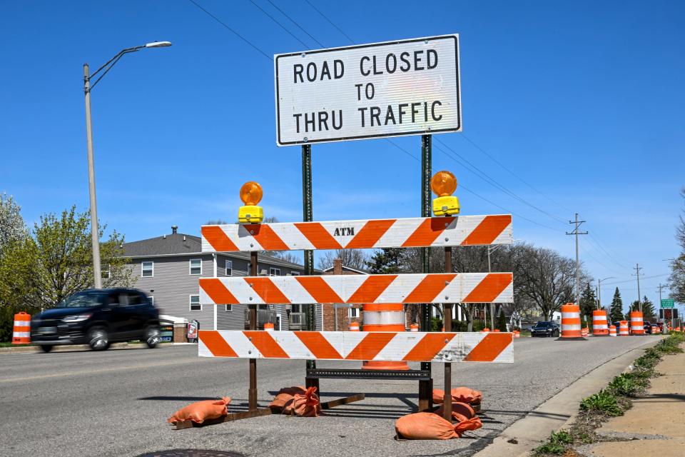 Road closure signs and traffic barrels are on Coolidge Road north of Saginaw Street as construction starts on Tuesday, April 16, 2024, in East Lansing.