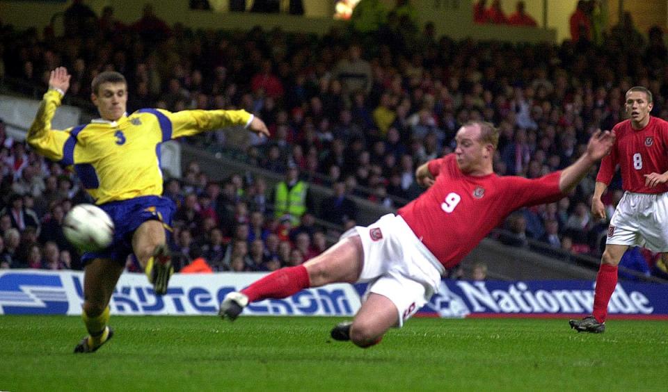 John Hartson volleys home for Wales in a 1-1 draw against Ukraine in March 2001 (David Jones/PA) (PA Archive)